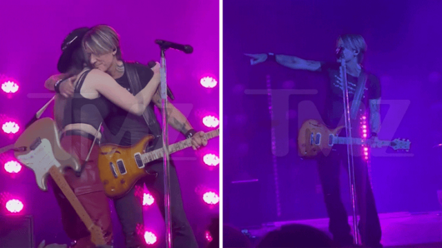 Keith Urban Points em Maggie Baugh no palco durante a mudança de letra 'Love You'
